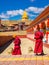 Buddhist monks walking in Yarchen Gar Monastery