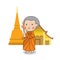 Buddhist novice walking with lighted candle in hand around temple