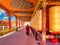 Buddhist nun walking at Prayer wheels in Yarchen Gar Monastery