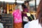 Buddhist pray and worship with lotus flower and incense and blurred temple background