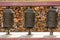 Buddhist prayer mani wall with prayer wheels in nepalese village