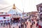 Buddhist Prayers Around the Square of Boudhanath Stupa During Sunset