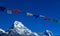 Buddhist Shrine Mountain with prayer flags over the blue sky