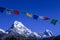 Buddhist Shrine Mountain with prayer flags over the blue sky