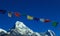 Buddhist Shrine Mountain with prayer flags over the blue sky