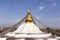 Buddhist stupa of Boudhanath and Kathmandu rooftops