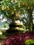 Buddhist stupa in the nature in Bali with flowers and trees