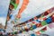 Buddhist Stupa with prayer flags on snow mountain