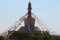 Buddhist stupa with prayers flags on top of hill, Hohhot