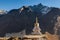 Buddhist stupa in Thame village with high rocky.