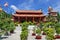 Buddhist temple in south Vietnam. Long Son Pagoda. Oriental garden with vibrant flowers and trees. glass-ceramic mosaic depicting