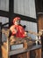 Buddhist wooden figurine statue inside Todai-ji temple and people, Nara Japan.