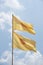Buddhist yellow flag on blue sky