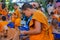 Buddhist young monk in Thailand temple wat doing hand crafts