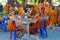 Buddhist young monks doing handcrafts in the temple yard