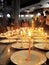 Buddhists lighting candles