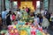 Buddhists and tourists bring fruit , sweeted drink and flowers,