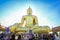 Buddhists worship big gold Buddha statue