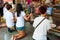 Buddist religious people praying at the temple from Damnoen Saduak Floating Market, Thailand