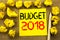 Budget 2018. Business concept for Household budgeting accounting planning written on sticky note paper on the vintage background.