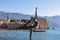 Budva - Ballerina statue (dancing girl) with panoramic view of the medieval old town of the coastal city of Budva, Montenegro