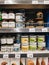 Budva, Montenegro - 21 august 2020: A supermarket shelf with non-GMO organic products - coconut oil, turmeric and other