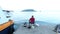 Budva, Montenegro - 27 June, 2017. Fishermans sitting on pier and fishing at Adriatic sea. Zoom out panoramic view to