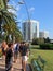 Budva / Montenegro - July 18, 2014: Tourists walk along the sidewalk along the palm trees and benches to hotels in Budva