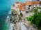 Budva, Montenegro. Turquoise waters of Adriatic sea and orange tile roofs