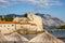 Budva old town beach and Citadel fortress city wall in Budva, Montenegro