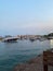 Budva`s harbour with boats and old town on the background