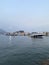 Budva`s harbour with boats and Sveti Nikola Island on the background