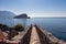 Budva - Scenic view over Saint Nicholas island (Sveti Nikola) and Adriatic Sea seen from walls of the citadel