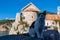 Budva - Small kitten with scenic view of the wall of historical medieval citadel of Budva