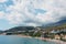 Budvan coast in Montenegro. Coastline of the cities of Rafaelovici and Beechichi. Long beach with sunbeds and umbrellas