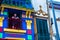 BUENOS AIRES / ARGENTINA - 05/04/2019: Old man on the colorful blue balcony in a old building in Caminito, Argentina