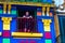 BUENOS AIRES / ARGENTINA - 05/04/2019: Old man on the colorful blue balcony in a old building in Caminito, Argentina