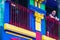 BUENOS AIRES / ARGENTINA - 05/04/2019: Old man on the colorful blue balcony in a old building in Caminito, Argentina