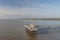 Buenos Aires, Argentina - May 16th, 2023: Fishermen on a dock in the Rio de la Plata on the Quilmes waterfront