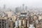 Buenos Aires Central Business District (Microcentro) skyscrapers skyline in winter under cloudy lead sky in heavy fog.