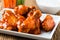 Buffalo chicken wing with cayenne pepper sauce