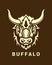 Buffalo head silhouette on shield vector emblem