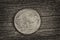 Buffalo Nickel on aged wood