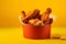 Buffalo Wings tasty fast food street food for take away on yellow background