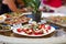 Buffet with Caprese Salad and other snacks outdoors