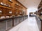 Buffet modern restaurant in contemporary style. cold cabinets and decorative shelves with bottles. Restaurant design