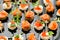 The buffet at the reception. Assortment of canapes. Banquet service. catering food, snacks with salmon and caviar. rye