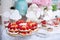 Buffet with sweets. Cakes with raspberries. Sweet table for banquets, weddings, parties
