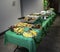 Buffet table with assorted Filipino food ready to serve