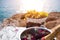 Buffet table fruit and wine. wedding in cyprus, bride and groom on a stone bridge in Agia Napa. The view of the sea. On